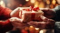 Adult hands giving a christmas gift to each other