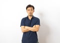 Adult handsome Chinese man wearing blue shirt standing over isolated white background feel depressed Royalty Free Stock Photo