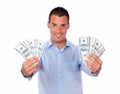 Adult handsome guy holding his cash