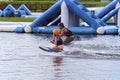 Adult Helps Child To Kneeboard