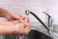 Adult helps child to wash his hands Royalty Free Stock Photo