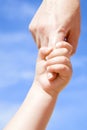 Adult giving hand to a child Royalty Free Stock Photo