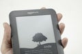 Adult holding kindle reader