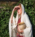 Girl with a pot in ancient clothes Royalty Free Stock Photo