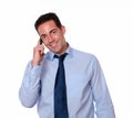 Adult latin man speaking on his cellphone Royalty Free Stock Photo