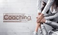 Adult learning. Word Coaching and people holding hands together over wooden background, top view