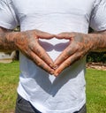 Adult Male With Dirty Tattooed Hands Making A Heart Gesture