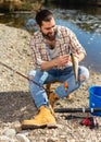 Adult male fisherman holding fish in his hands Royalty Free Stock Photo