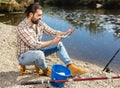 Adult male fisherman holding fish in his hands Royalty Free Stock Photo