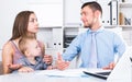 Adult male lawyer talking with young woman