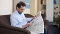Adult male looking at map, planning trip, vacation and traveling, tourism