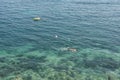 An adult male makes scuba diving in clear water