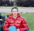 Adult Male Resting Outside in a Down Coat in Steamboat Colorado After Running a 100 Mile Iron Man Ultra Race