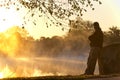 Adult Male Stands Alone At Sunrise Staring Towards