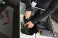 Adult male IT technician performing server hardware upgrade inside a computer rack during maintenance Royalty Free Stock Photo