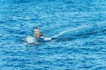 Adult Man aboard a Small Wooden Motorboat - Mediterranean Sea Italy Royalty Free Stock Photo