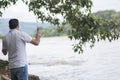 Adult man fishing river out of focus Royalty Free Stock Photo