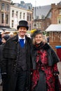 Adult man frock coat, standing with a woman on the street Royalty Free Stock Photo