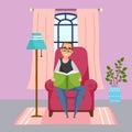 Adult man in glasses sitting at chair and reading book, leisure time during quarantine isolation