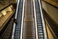 Adult man going down on escalator at the the subway station in Frankfurt am Main, Germany