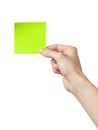 Adult man hand holding green sticky note Royalty Free Stock Photo