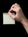 Adult man hand holding sticky note Royalty Free Stock Photo