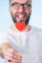 Adult man with heart on stick Royalty Free Stock Photo