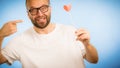 Adult man with heart on stick Royalty Free Stock Photo