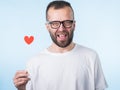 Adult man with heart on stick Royalty Free Stock Photo