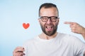 Adult man with heart on stick Royalty Free Stock Photo