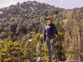 Adult  man hiker standing on top of mountain Royalty Free Stock Photo