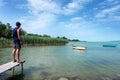 Adult man looks at Balaton Lake in the summer