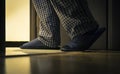 Adult man in pijamas walks to a bathroom at the night. Men`s healths concept Royalty Free Stock Photo