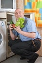 Adult man putting fresh vegetables Royalty Free Stock Photo