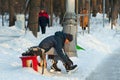 Adult man putting on skates in Sokolniki Park 23.01.2019