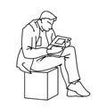 An adult man is reading a book sitting on a cube. Vector illustration of a man gazing intently into a magazine or Royalty Free Stock Photo