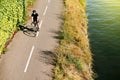 Adult man riding bike above aerial near river France Royalty Free Stock Photo