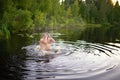 Adult man splash water in forest lake Royalty Free Stock Photo