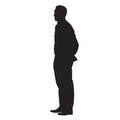 Adult man standing with his hands behind his back. Side view Royalty Free Stock Photo