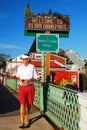 An adult man strolls across the historic bridge in Kennebunkport, Maine