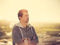 Adult man thinking at the sunset outdoors Royalty Free Stock Photo