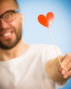 Adult man with heart on stick Royalty Free Stock Photo