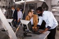 Adult man and woman in protective masks in panic looking for a solution on the computer in quest room Royalty Free Stock Photo