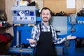 Adult man worker displaying his workplace Royalty Free Stock Photo