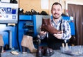 Adult man worker displaying result of his work Royalty Free Stock Photo