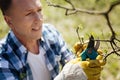 Adult man working with secateurs