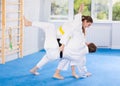 Adult man and young woman training judo fight Royalty Free Stock Photo