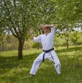 An adult master in karategi makes blocks hands Kaderov