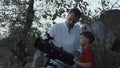 Man with boy using telescope Royalty Free Stock Photo