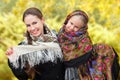 An adult mother with her daughter in russian kerchiefs